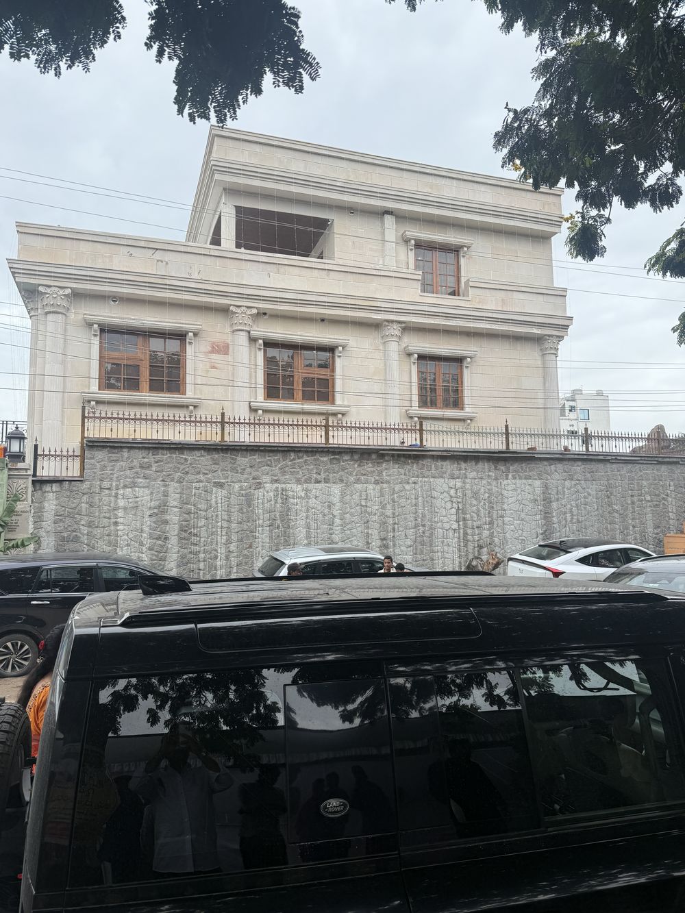 Street view of the stone-clad Hyderabad residence
